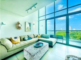 Open kitchen and dining area in loft apartment with modern finishes at Bahia Playa Serena Nueva Gorgona