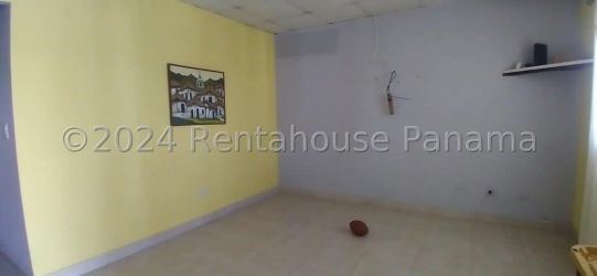 Bright living room with ceramic tile floors and neutral walls in house for sale La Chorrera Panama