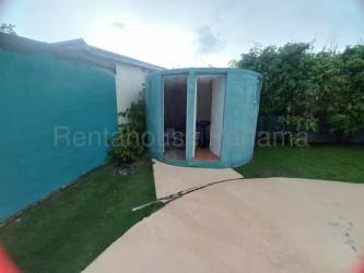 Spacious open kitchen with granite countertops breakfast bar and tile floors in Coronado beach property