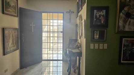 Traditional entry hallway with art wall of home in Los Santos Panama for sale