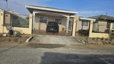 Bedroom with bunk bed and tile floor in traditional Panamanian house for sale in Las Tablas Panama