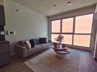 Modern kitchen with marble floors and sleek cabinetry in PH Centriqo Panama Pacifico