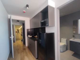 Bedroom with large window, marble floors, and minimalist style PH Centriqo Panama