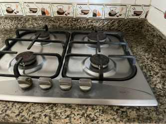Kitchen with granite look countertops, built-in stove and oven, tile backsplash house rental Arraiján Panama