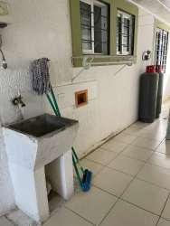 Laundry area with utility sink, bars, tiled floor Residencial Aragón house for rent