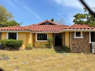 Lush garden with covered patio area at beach house San Carlos Panama