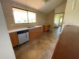 Bright kitchen with breakfast bar tile floors Costa Esmeralda beach house Panama