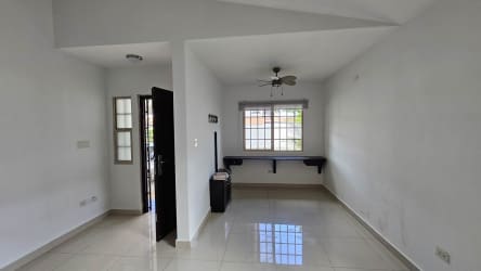 Bright living room with tiled floor, ceiling fan and large window PH Spring Hills Costa Verde Panama