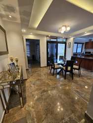 Wide tiled terrace backyard garden in PH Los Bosques Puerto Madero Costa Verde