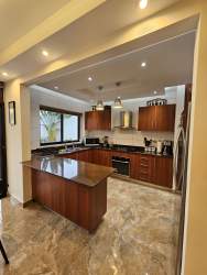 Spacious living dining area with access to terrace in Puerto Madero Costa Verde house