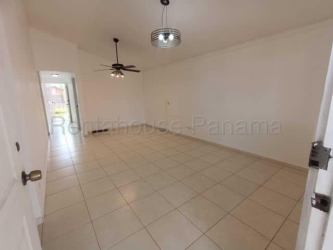 Bright empty living room with ceramic tile floor and ceiling fan in Villas del Campo La Chorrera