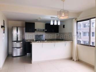 Kitchen with granite countertop, pendant lights and stainless appliances in PH Woodlands Panama Pacifico