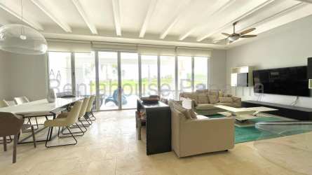 Spacious living room with large windows and tray ceiling in Buenaventura Ocean Lake villa Coclé Panama
