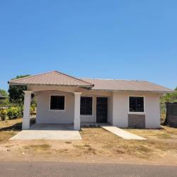 Single-story house with hip roof, front porch, garage in Aguadulce Panama