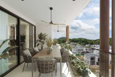 Spacious balcony with lush garden views at PH Explora Panama Pacifico