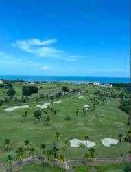Modern living room penthouse with expansive windows and full ocean view in Vista Mar Golf Beach Marina Panama