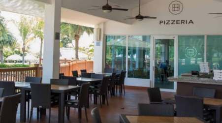 Multiple swimming pools with palm trees and sun decks in Bijao Beach Club Panama