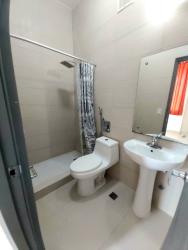 Laundry area with utility sink, washer dryer connection, ceramic walls PH Natura Costa Verde Panama