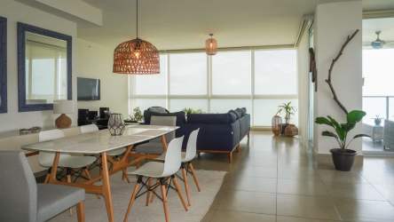 Fully equipped modern kitchen with granite countertops and stainless steel appliances in PH Rio Mar San Carlos