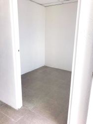 Small renovated room with ceramic floors and white walls in house for sale Vacamonte Panama