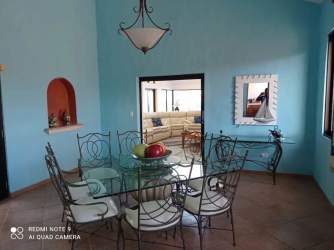 Spacious coastal living room luxury beachfront Punta Barco villa with panoramic ocean views