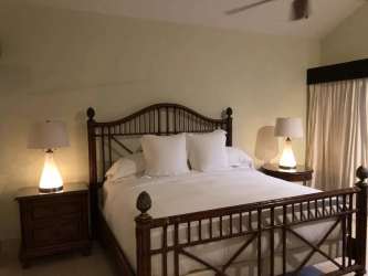 Elegant living room with luxury furnishings, double-height ceiling, garden view at Buenaventura Villa Panama