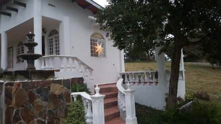 Large well-lit living room with garden views, El Valle Village Panama Oeste