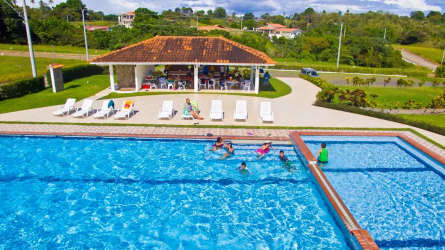 Gated community pool and tennis court amenities at El Valle Village San Carlos Panama