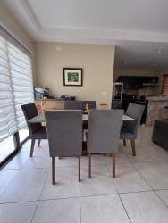 Dining room with large window and ceiling fan fully furnished Los Mandarinos Volcán