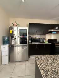 Kitchen with granite, stainless appliances, dark cabinets Los Mandarinos Volcán
