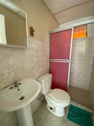 Small bedroom with tile flooring and window protector in Arraiján house for sale