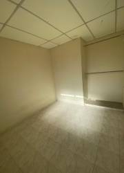 Empty small room with tile floors beige walls in affordable house Panama