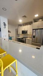 Primary bedroom with balcony access, ocean views, walk-in closet Italian tile Chiriquí Panama