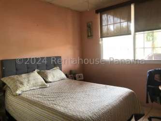 Laundry area with washing machine and water heater storage space Panama family house