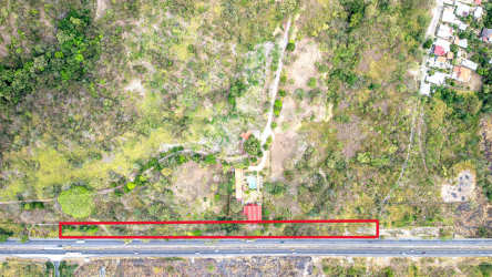 Large flat plot adjacent to highway bordered in red San Carlos Panama