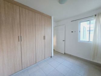 Large outdoor swimming pool with gazebo and palm trees in PH Mirador del Mar La Chorrera