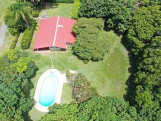 Large tropical garden with swimming pool and mature trees at beach house near Panama's Pacific Coast
