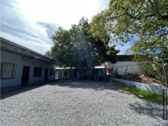 Gravel yard with entries to multiple rental apartments investment property David Panama