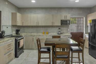 Luxury villa with modern granite kitchen island in Coronado Resort Panama