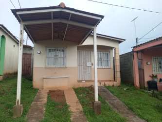 Single family house with covered carport and secured windows in Urbanización Los Guayacanes Chorrera Panama