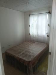 Minimalist living room with blue couch tile floor in Los Guayacanes La Chorrera