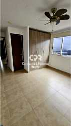 Bedroom with ceiling fan, window, and built-in closet in PH Coronado Paradise