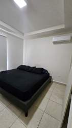 Covered outdoor terrace with backyard lawn in Playa Dorada Vacamonte Panama rental