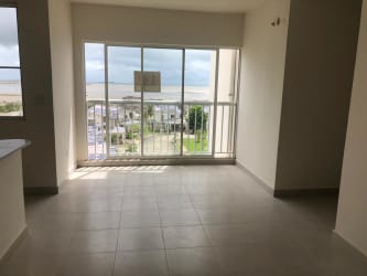 Modern kitchen with dark wood cabinets, breakfast bar in Playa Dorada Vacamonte Panama