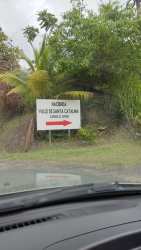 Flat fenced vacant lot with mature trees for building in San Carlos Panama Oeste