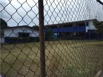 Fenced lot containing two buildings and grassy area in El Coco La Chorrera Panama
