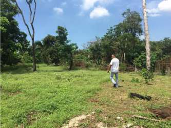 Blue painted building with chain-link fence on development plot in El Coco La Chorrera Panama