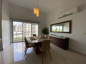 Main bedroom with ensuite bathroom, AC unit, large window furnished rental PH Soleo Panama Pacifico