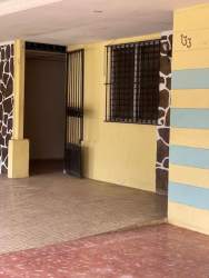 Bedroom with tiled floor and window in affordable La Floresta Arraiján Panama house