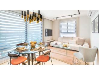 Bright open concept living and dining space with large windows at PH Parterre Panama Pacifico